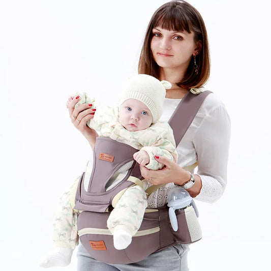 Mum holding baby in 3-in-1 ergonomic baby carrier with hipseat in Australia